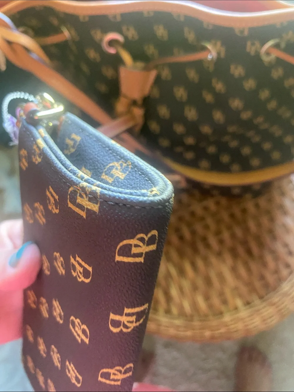 Dooney & Bourke dark brown and Gold Monogram Wristlet